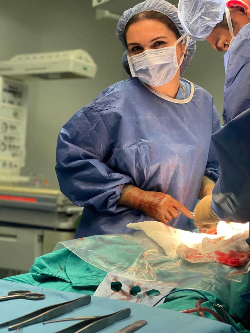 Female surgeon performing advanced gynecology procedure